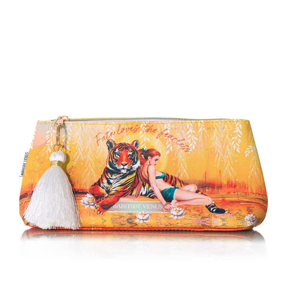 Barefoot Venus Apricot Brandy Vegan beauty bag depicting a woman leaning against a tiger with an orange background