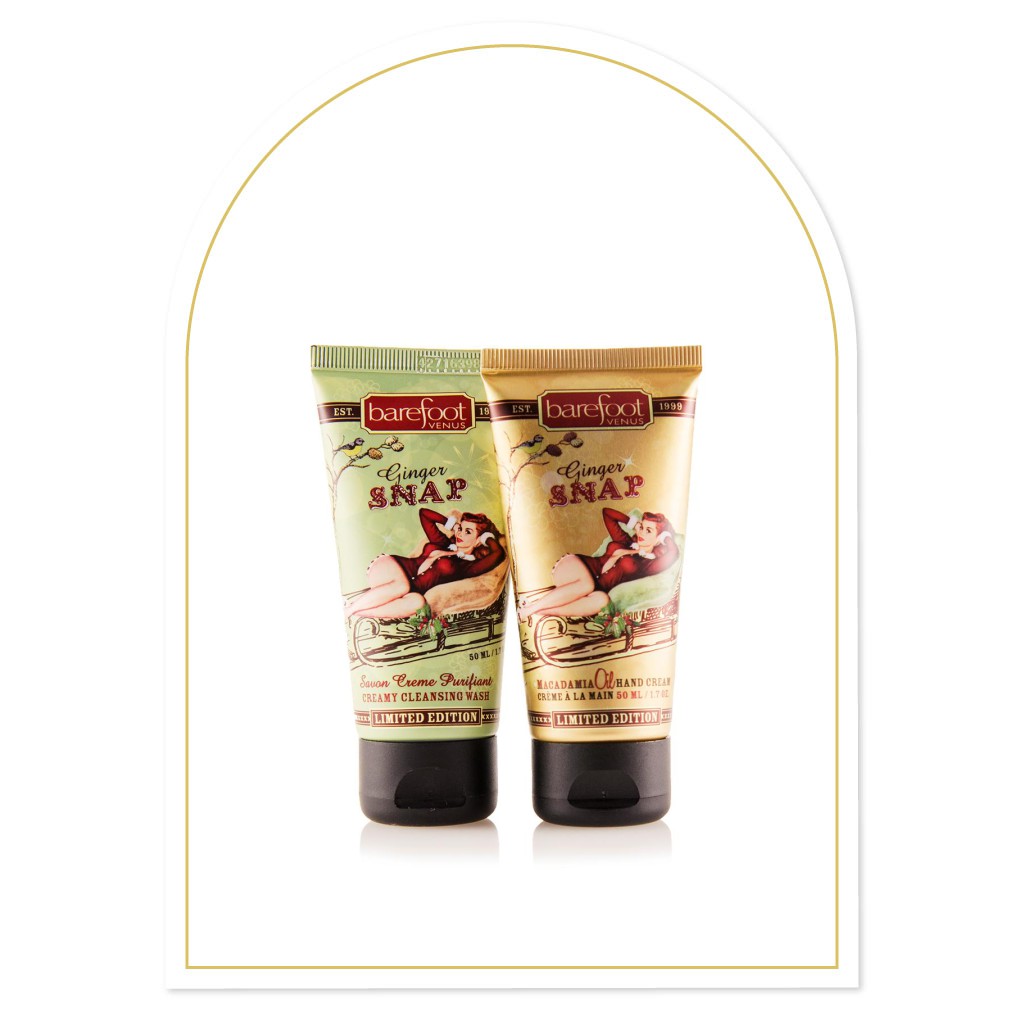 Two tubes of Barefoot Venus products. One of 'Ginger Snap' body wash and one of 'Ginger Snap' hand cream on a white background with a decorative frame.