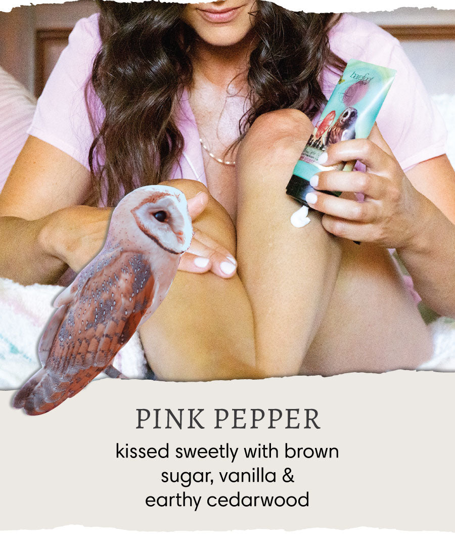 Woman applying Barefoot Venus Pink Pepper Body Cream to her leg and an owl. Text reads "Pink Pepper - kissed sweetly with brown sugar, vanilla & earthy cedarwood".