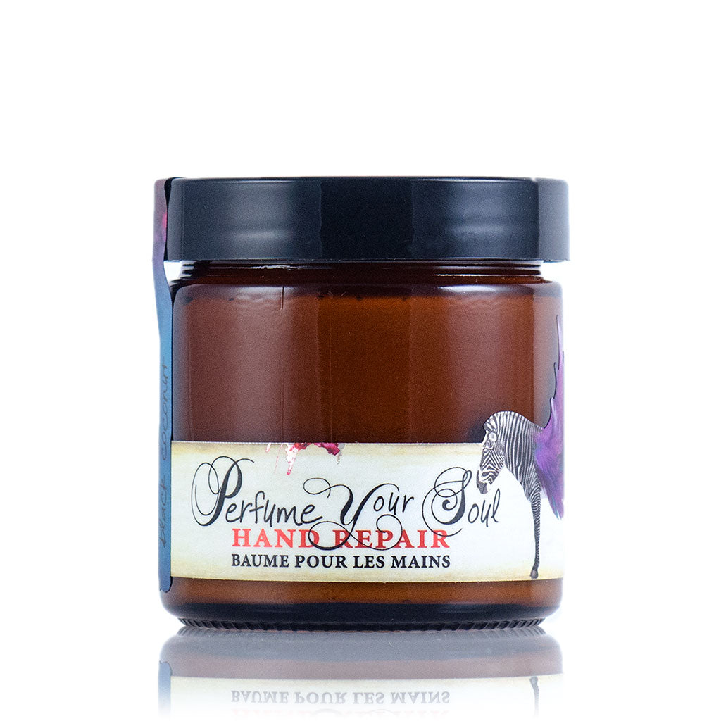 A jar of Barefoot Venus Black Coconut instant hand repair with a black lid and a zebra floral design.