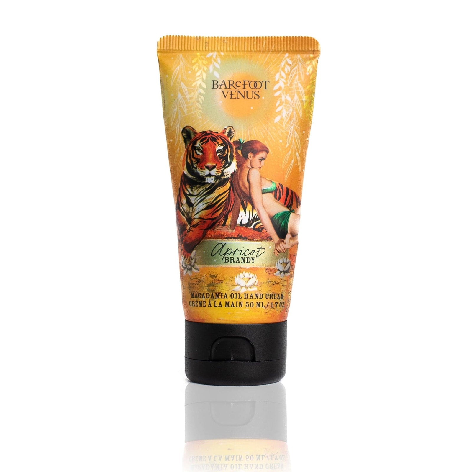 A person dispensing a tube of Apricot Brandy macadamia oil hand cream with a label featuring illustrations of a tiger and woman onto their hand.